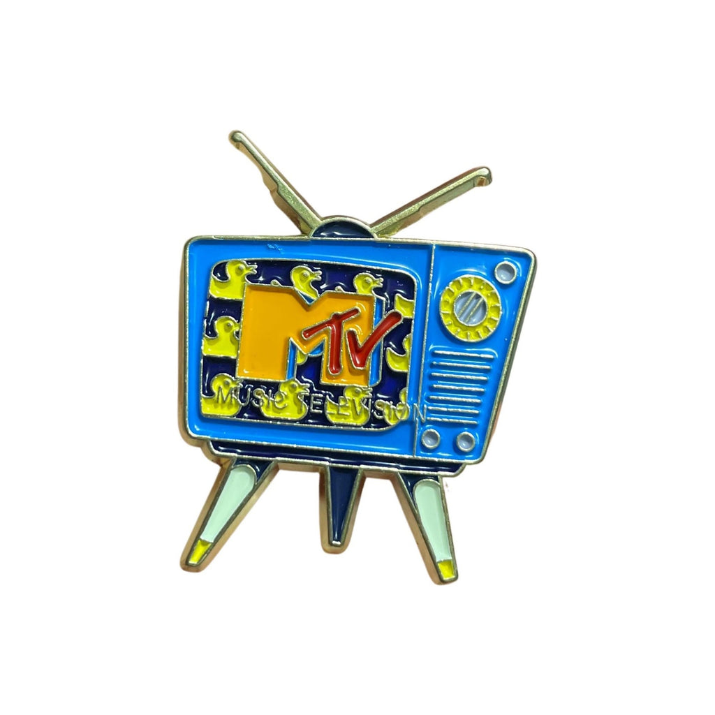 Retro MTV enamel pin designed as a vintage blue television with antennas, featuring the classic MTV logo and colorful 90s-style screen pattern