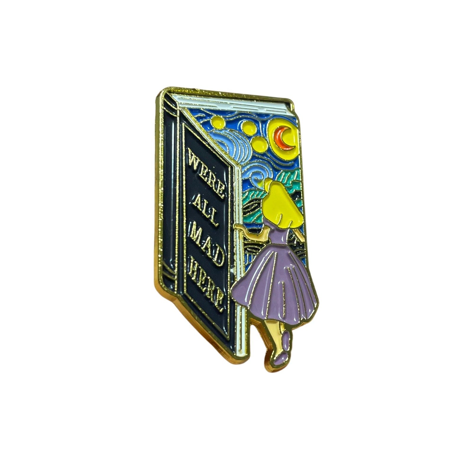 We’re All Mad Here enamel pin with open book and whimsical night sky Alice in Wonderland inspired design