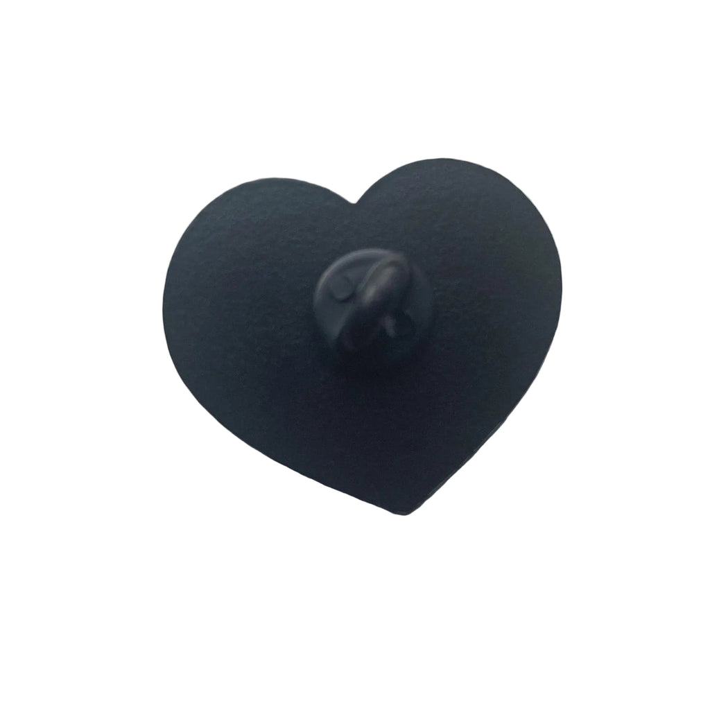 Hey Arnold enamel pin featuring Arnold and Helga holding hands inside a heart design