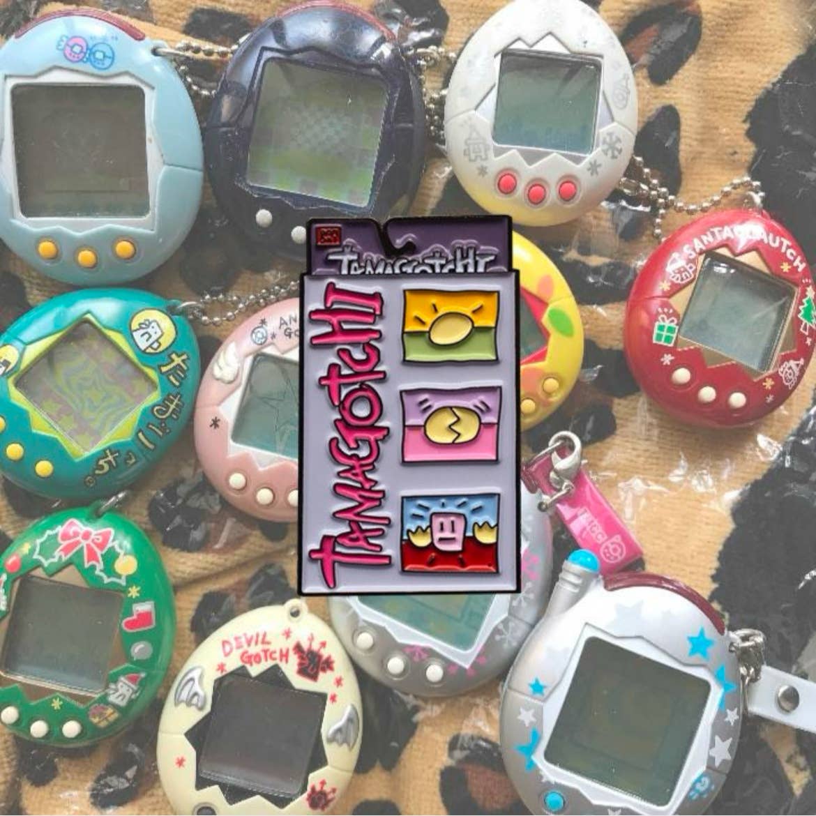 Tamagotchi enamel pin retro 90s virtual pet toy design