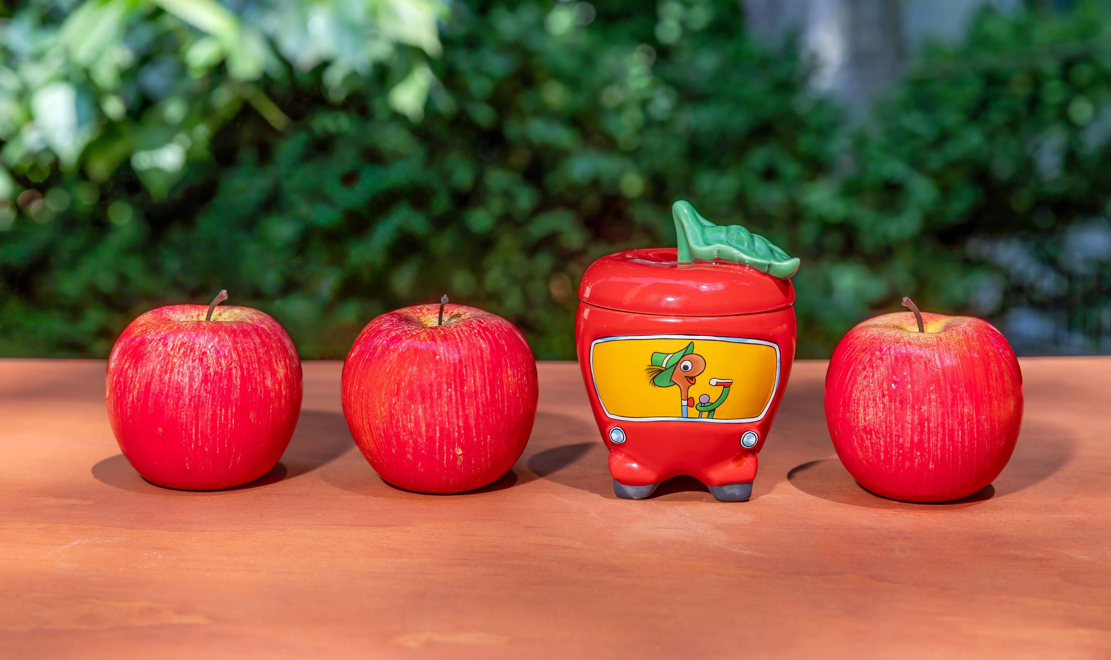 Ceramic apple shaped car mug with lid featuring Lowly Worm character inspired by Richard Scarry Busytown