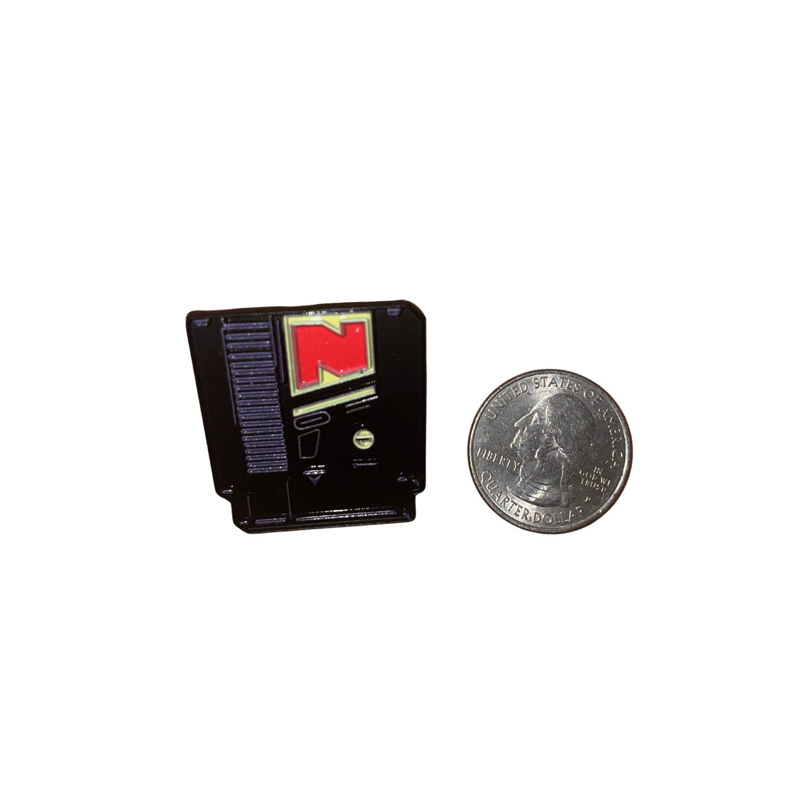 Nintendo NES cartridge enamel pin designed like a classic retro video game cartridge with minimalist detailing